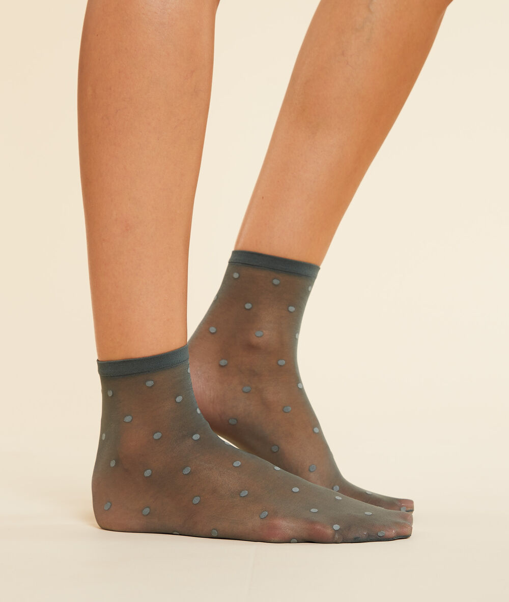 Chaussettes mode en plumetis kaki.