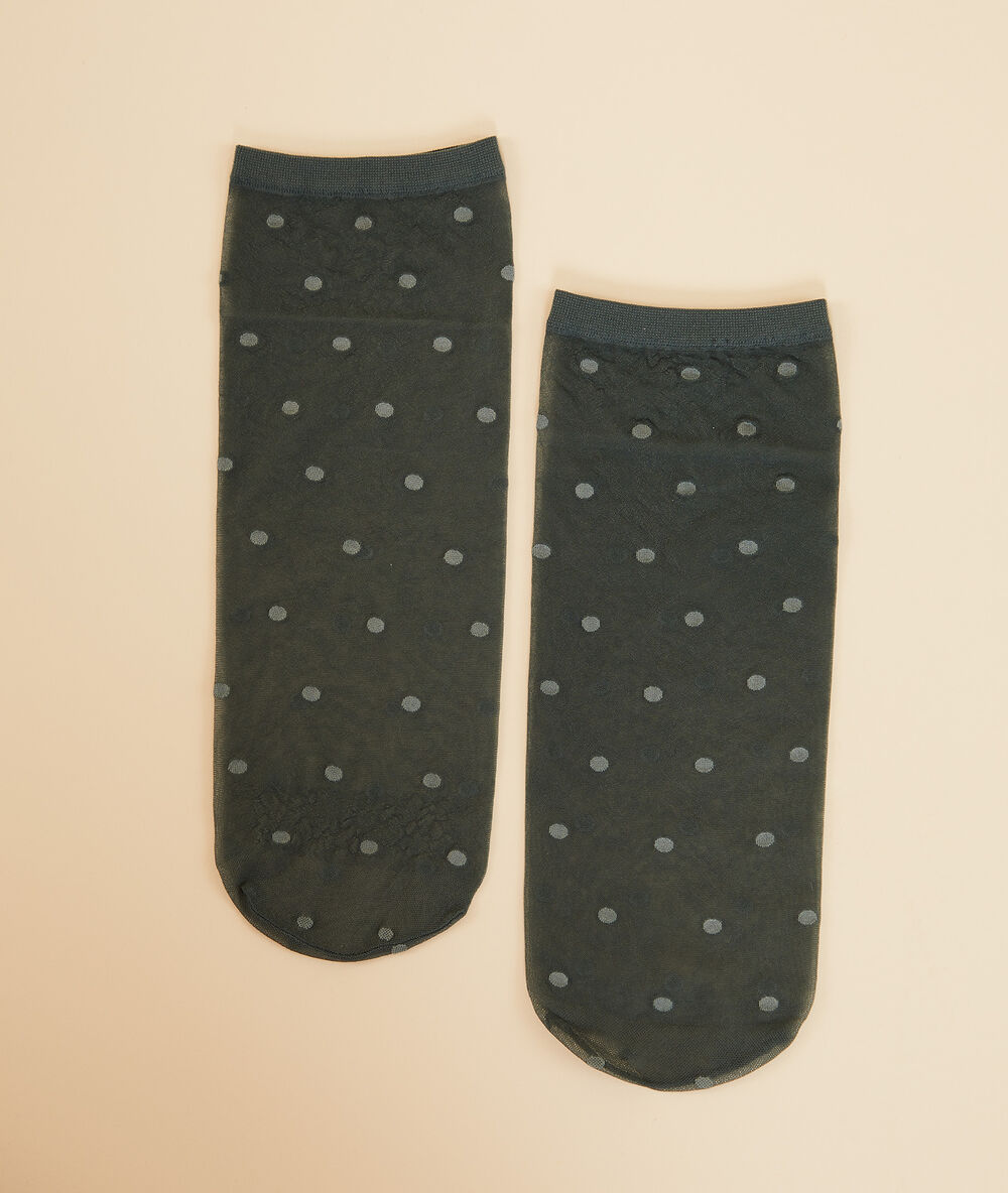 Chaussettes mode en plumetis kaki.